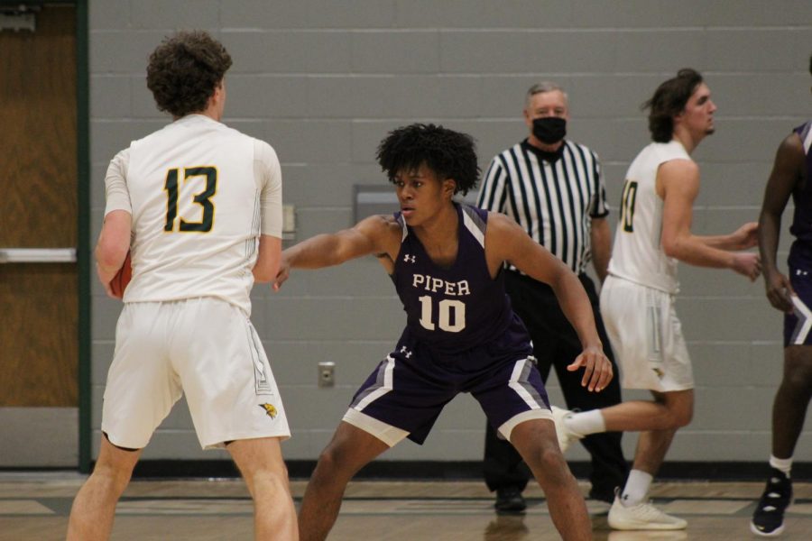 Junior Jaron Briggs locking up on defense against the Bobcats. 