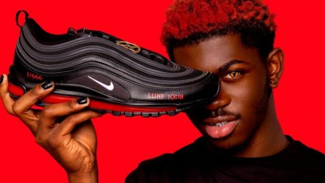 Pair of Lil Nas X and MSCHF shoes with bible verse and shoe number showing. Photo courtesy of MSCHF.
