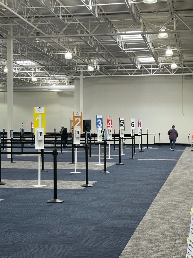 After filling out paperwork, individuals are placed into lines where they must social distance.