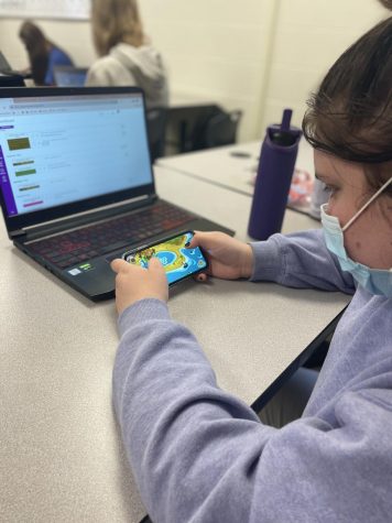 Junior Abigail Cahill plays Moshi Monsters Egg Hunt after completing school work.