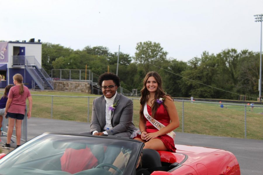 Candidates Jai Moore and Lexi Gerber smile for the camera after finishing the parade.