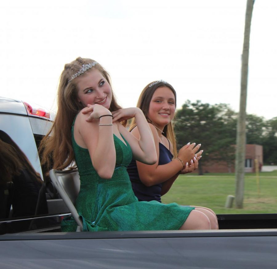 Underclassmen Princesses goof around together while riding in the back of a truck.