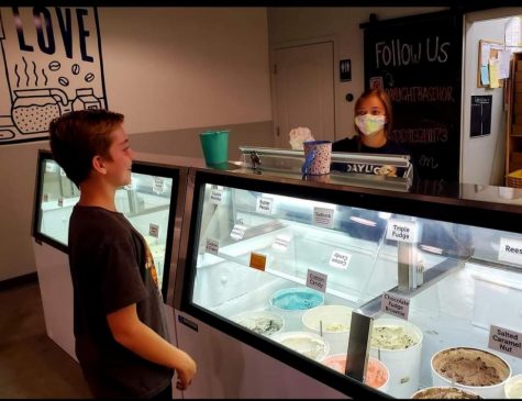 Senior Kaycee Scott works a night shift at Daylight Donuts after school.