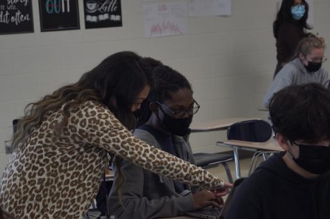 Teacher Marta Yang assists student with an class assignment. Fun fact about Yang, she grew up in KCK and attended USD 500 schools her whole life.