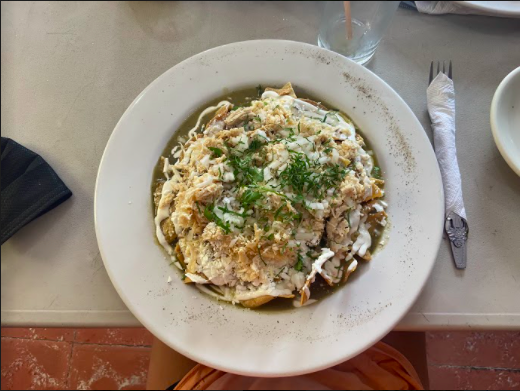 Chilaquiles topped with chicken and salsa Verde.