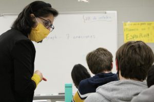 Spanish Teacher Rachel Ferguson helps a student with a problem in her Spanish 2 class.