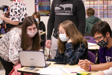 Advanced algebra students work together while in a class with 36 students.