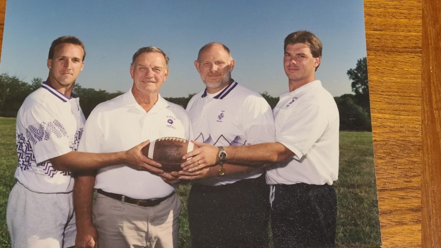 Coach Black poses with former Piper head coaching staff.  