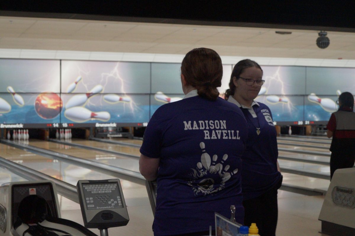 Molly Morse bowls with teammate Madison Raveill at her first varsity meet of the season and earned 3rd place.