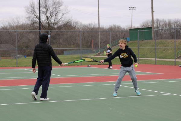 Navigation to Story: Boys tennis program, players grow